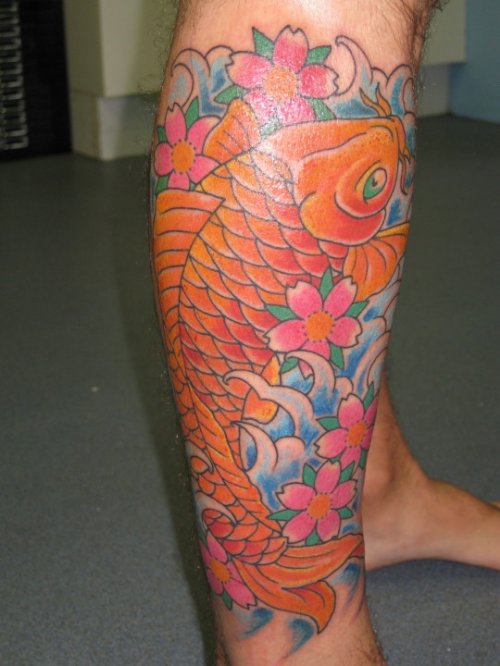 Pink Flowers And Carp Fish Tattoo On Right Leg